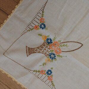 Vintage cotton tablecloth with embroidered floral basket border and crochet edge